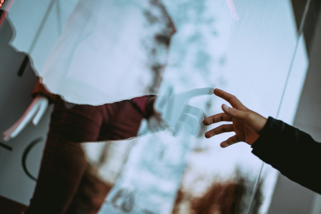 person reflecting in mirror