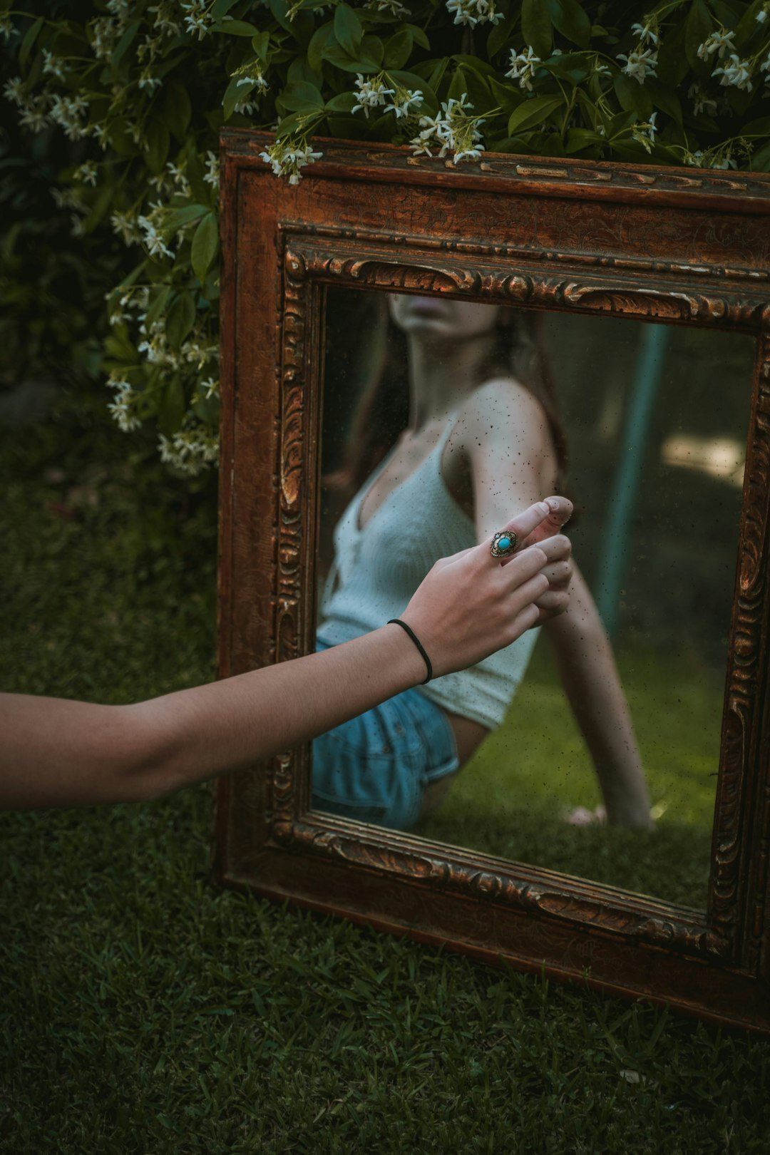 person reflecting in mirror